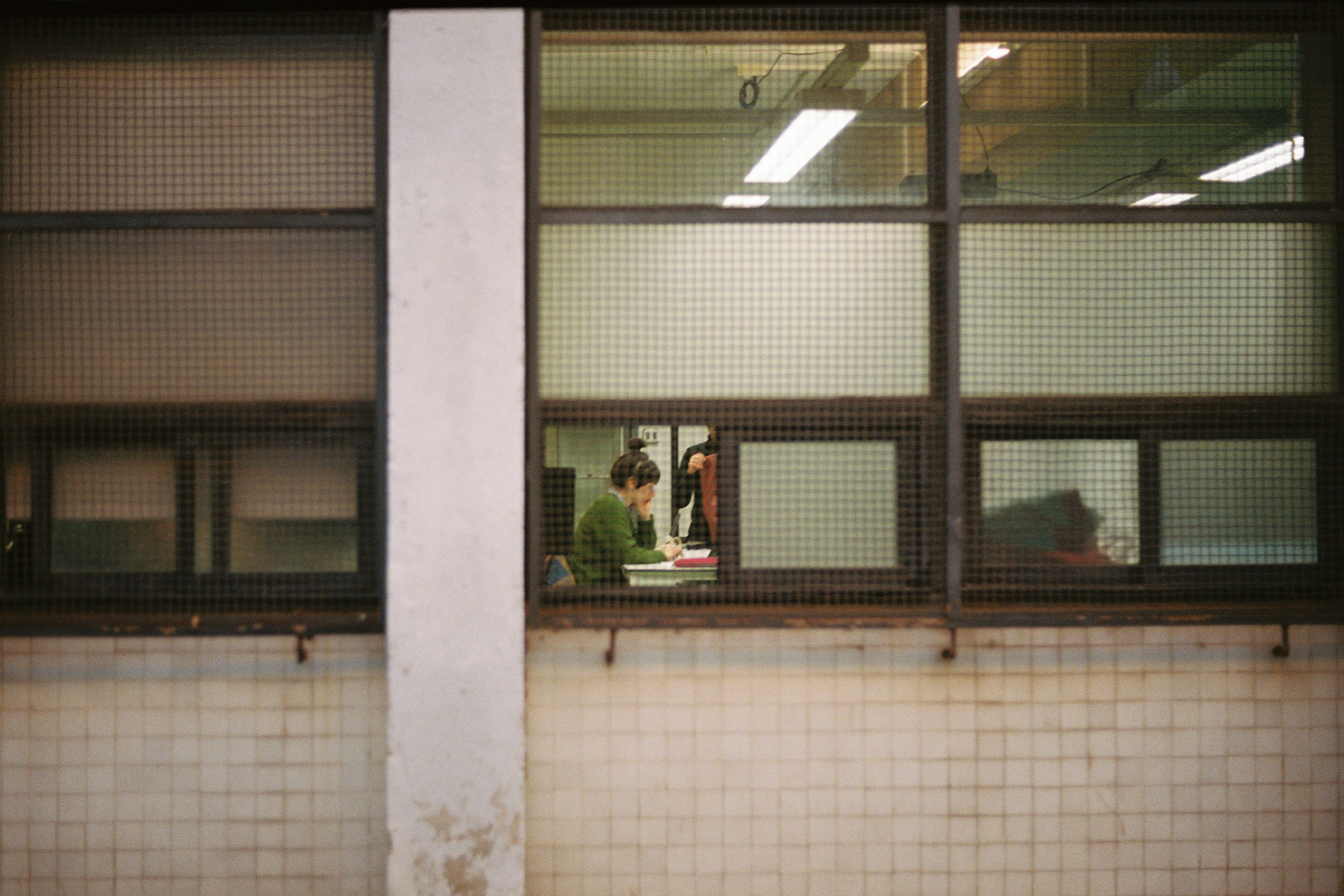 Photo by Masi from Pexels: https://www.pexels.com/photo/office-scene-through-large-industrial-window-20069166/